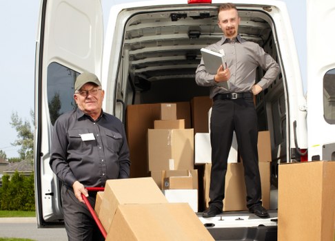 Local moving team navigating narrow residential access in Queens Park