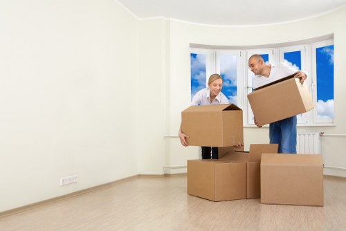 Commercial movers handling desks and office equipment