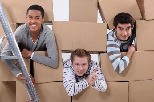 Moving truck near period homes and apartment buildings in Queens Park