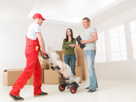 Commercial moving team assisting a business relocation in Queens Park
