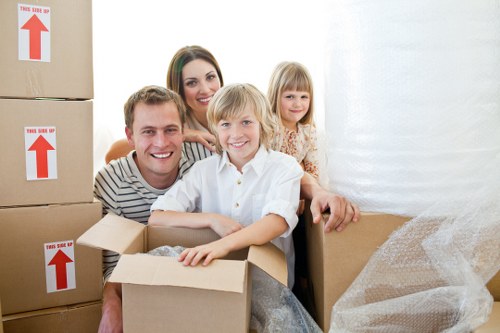 Moving furniture through a Queens Park property with care