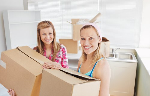 Packed boxes and furniture ready for a Queens Park move
