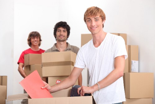 Local removals team loading furniture for transport in Queens Park