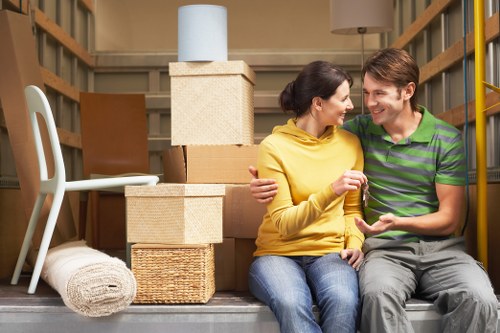 Unpacking support in a Queens Park flat with boxes being sorted room by room